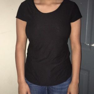 black shirt “x” design on back.